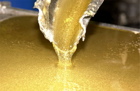 the golden mixture of corn syrup and sugar